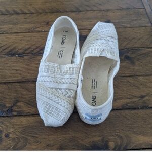 Women's off white slip on Toms shoes